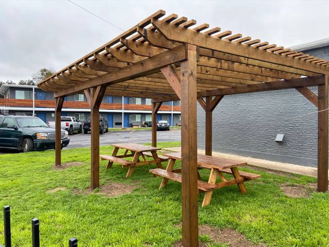 Covered pergola with picnic tables