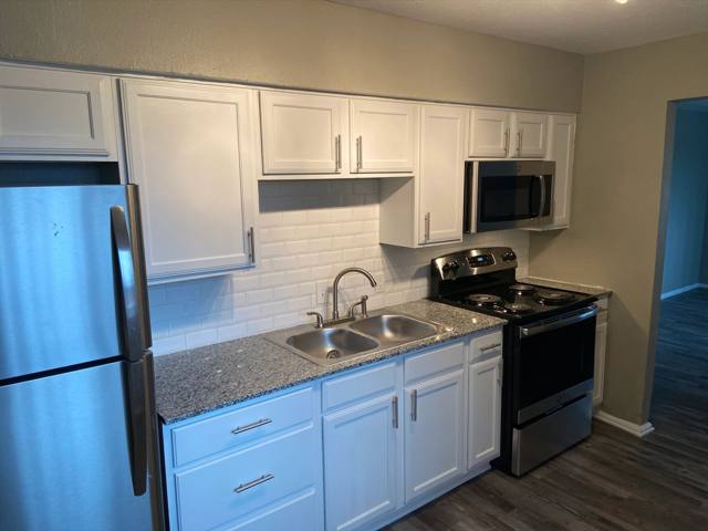 Kitchen with white shaker cabinets