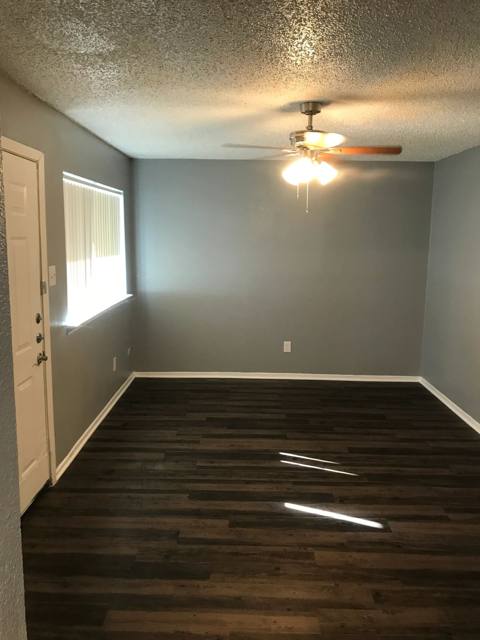 Bedroom with ceiling fan and wood-style flooring